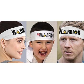 A group of people wearing headbands with the word warrior written on them.