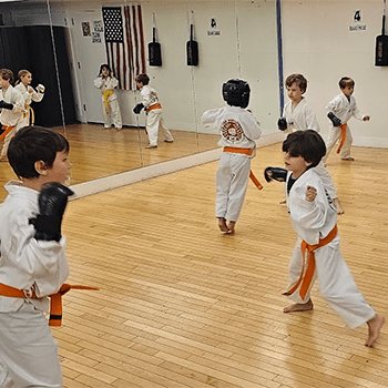 A group of young children practicing martial arts.
